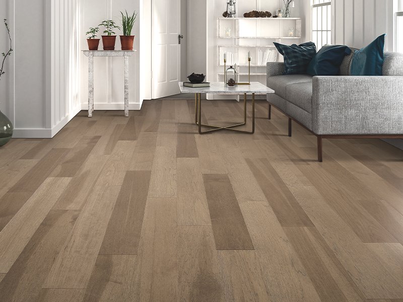 couch and table on luxury vinyl at Alabama Custom Flooring & Design